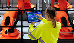 Woman inspecting a car assembly line