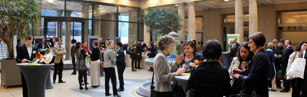 Several people standing in the reception area of an event