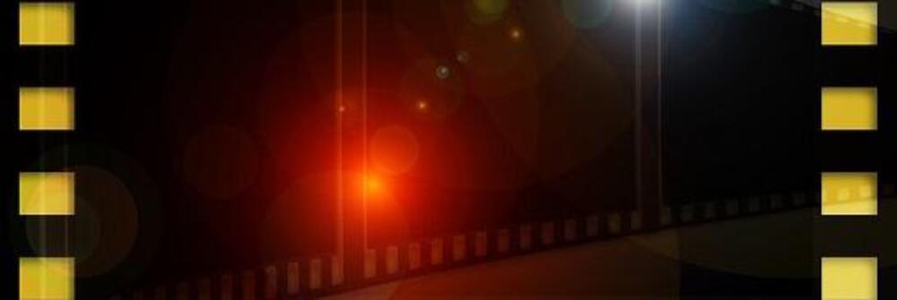 Photo reel frame with red light reflecting in the background